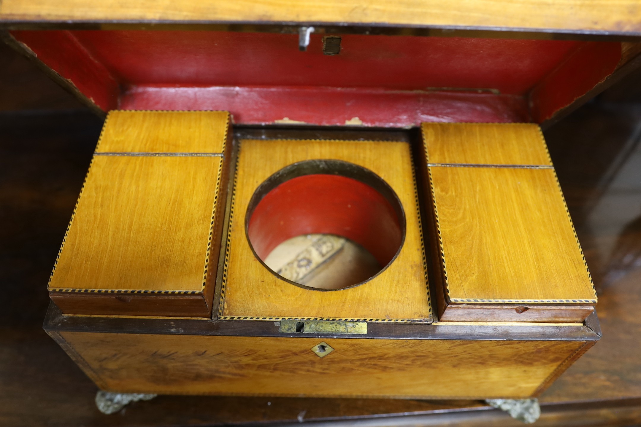 A Victorian flame-veneered tea caddy and another, smaller